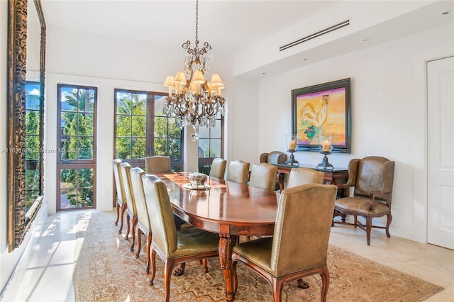 dining area with visible vents and a notable chandelier