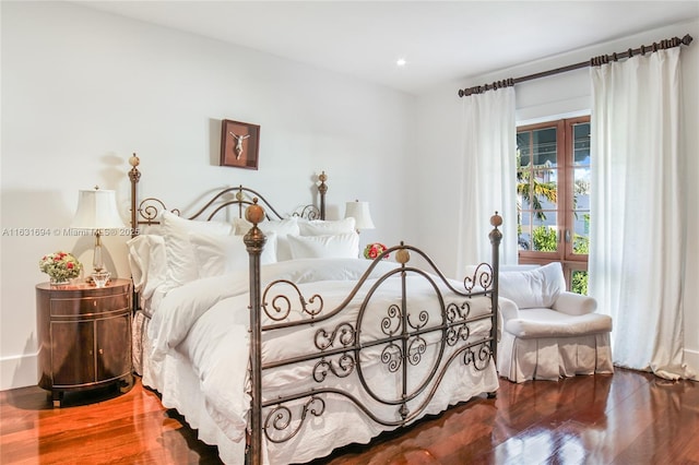 bedroom featuring wood finished floors and recessed lighting