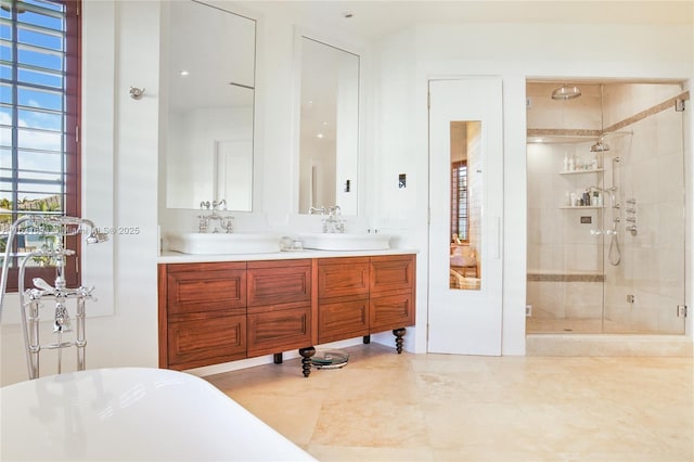 bathroom featuring a soaking tub, a sink, a shower stall, and double vanity