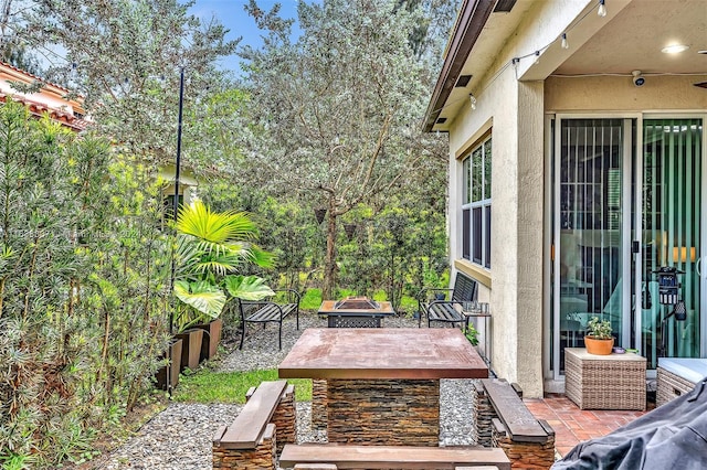 view of patio featuring a fire pit