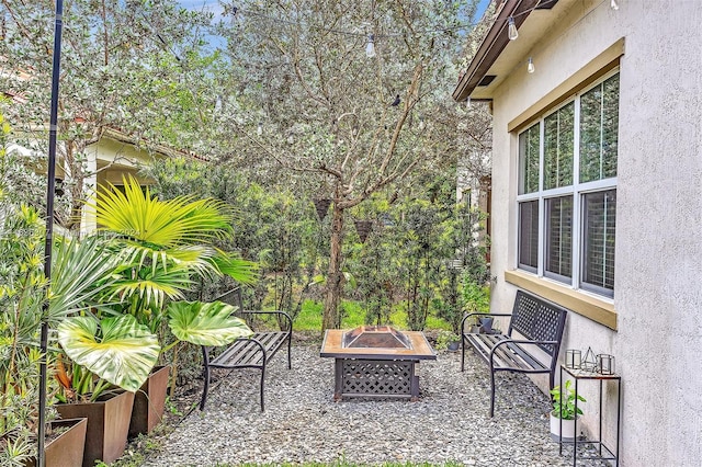 view of patio with an outdoor fire pit