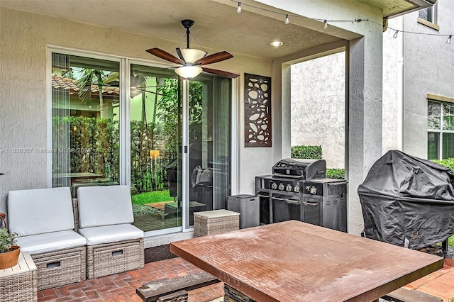 view of patio / terrace with ceiling fan and grilling area