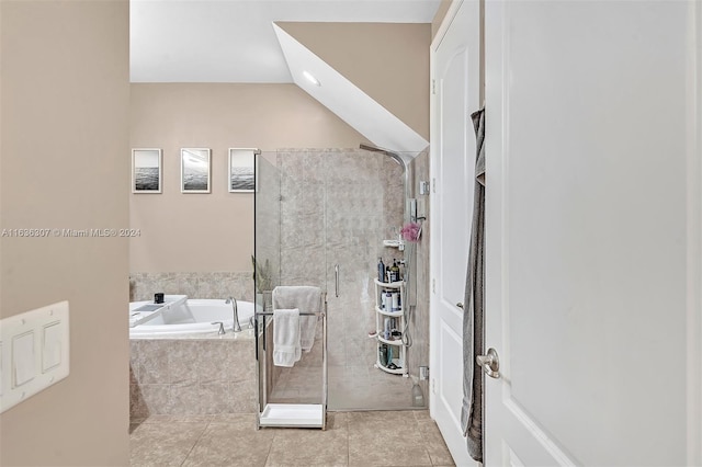 bathroom with tile patterned floors and separate shower and tub