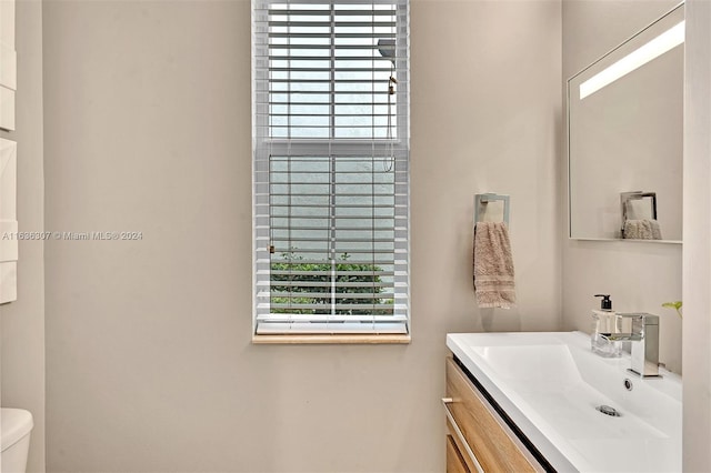 bathroom with vanity and toilet