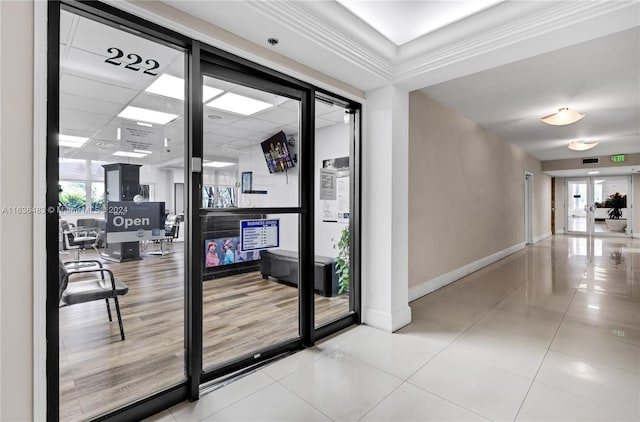 interior space featuring hardwood / wood-style flooring and crown molding