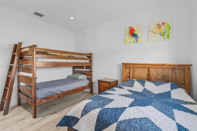 bedroom with light hardwood / wood-style floors