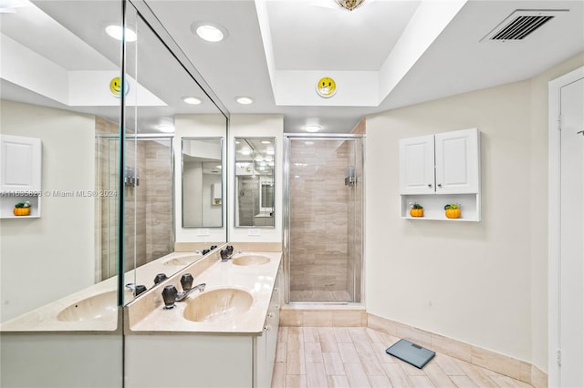 bathroom featuring vanity and an enclosed shower