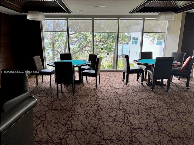 dining room featuring a healthy amount of sunlight and a water view