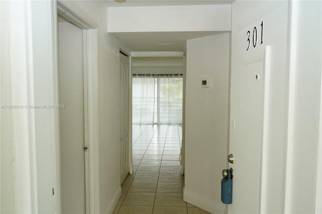 corridor featuring light tile patterned floors