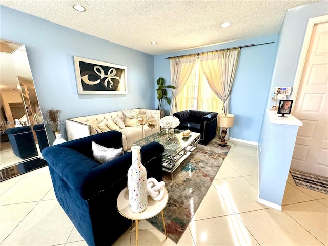 tiled living area with a textured ceiling, recessed lighting, and baseboards