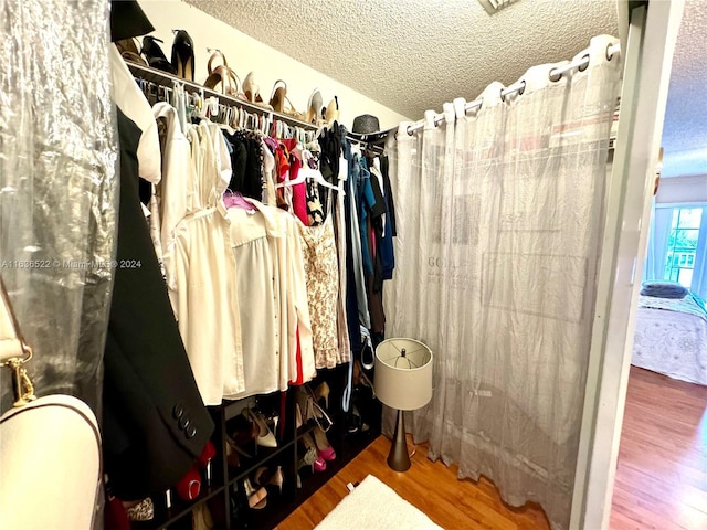 spacious closet with wood finished floors