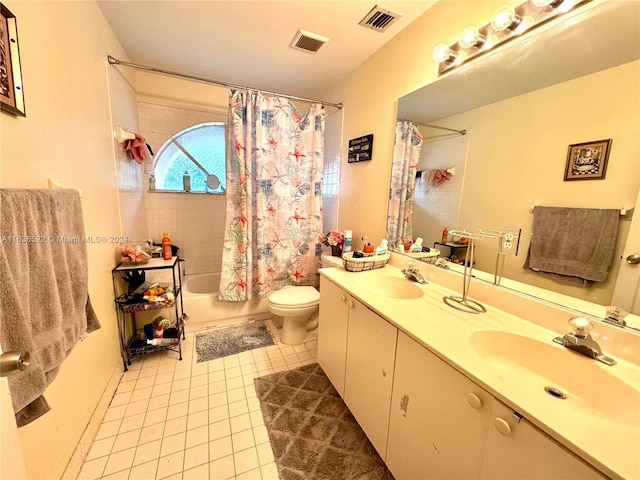 bathroom featuring visible vents, a sink, and tile patterned floors