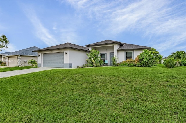 view of front facade with a garage and a front lawn