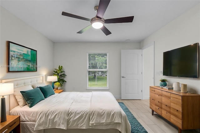 bedroom featuring light hardwood / wood-style floors and ceiling fan