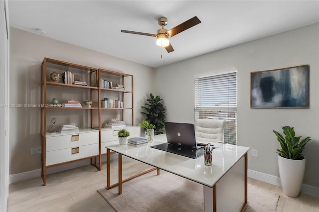 office area featuring light hardwood / wood-style flooring and ceiling fan