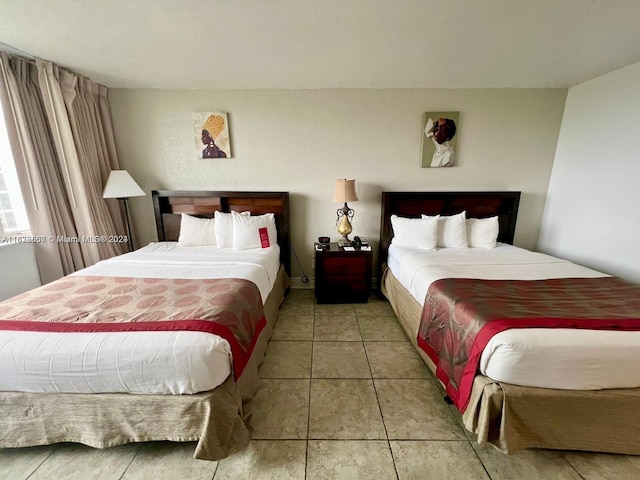 bedroom featuring light tile patterned floors