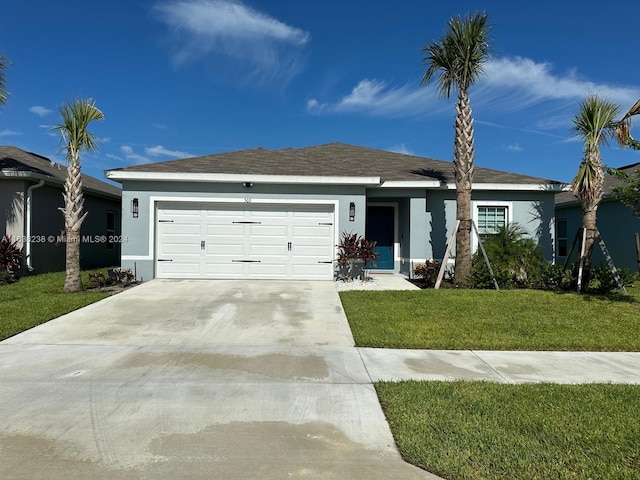 ranch-style house featuring a garage and a front yard