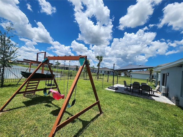 view of play area with a yard and a patio area