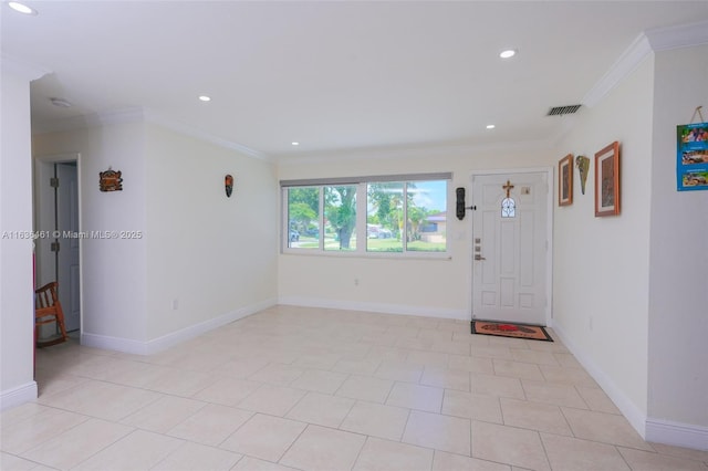 foyer entrance featuring visible vents, crown molding, and baseboards