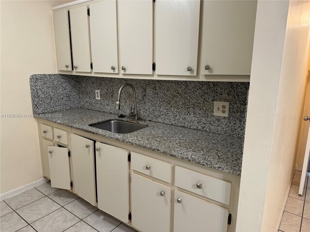 kitchen with white refrigerator, backsplash, stainless steel electric range oven, light tile patterned floors, and wall chimney range hood