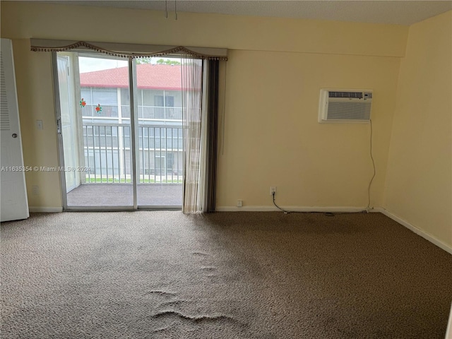 carpeted empty room with a wealth of natural light, baseboards, and a wall mounted AC