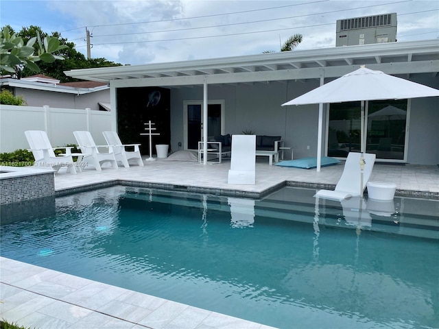 view of swimming pool with a patio