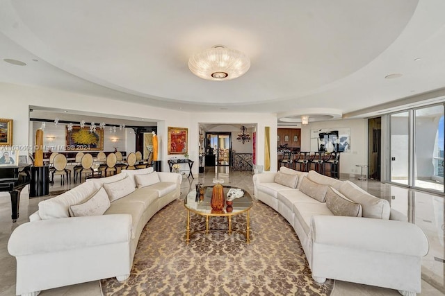 living room featuring a tray ceiling