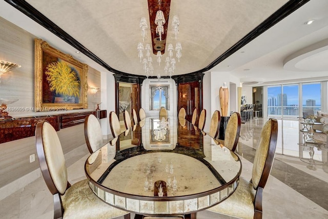 dining room with crown molding and decorative columns