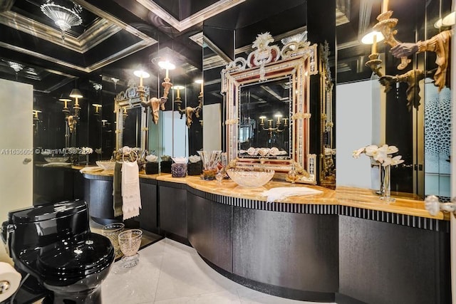 interior space featuring tile patterned floors, coffered ceiling, vanity, and ornamental molding