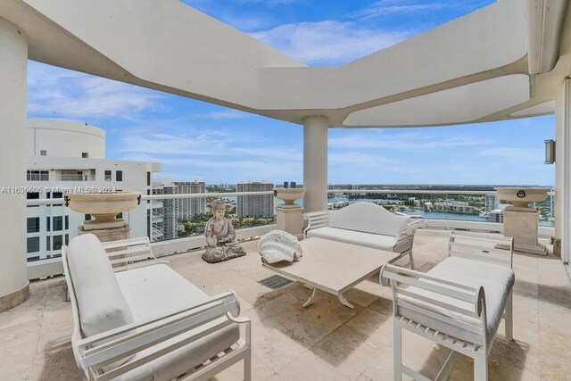 view of patio featuring a balcony