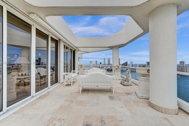 view of patio with a water view