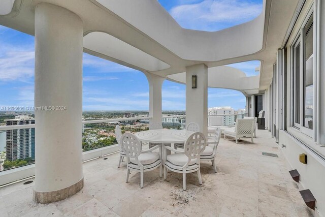 view of patio featuring a balcony