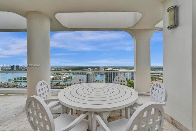 view of patio with a water view