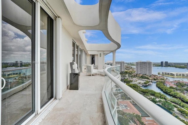 balcony featuring a water view