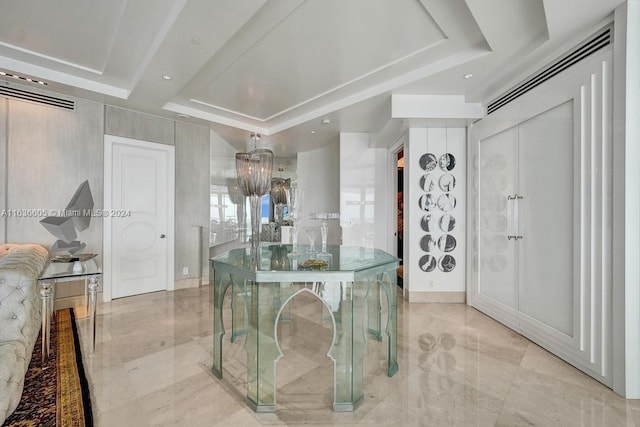 kitchen featuring a raised ceiling and light tile patterned floors