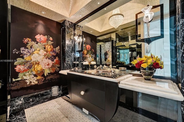 bathroom with vanity, a raised ceiling, and tile patterned floors