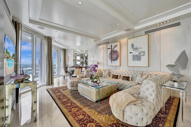 living room with a raised ceiling