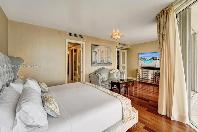 bedroom with wood-type flooring