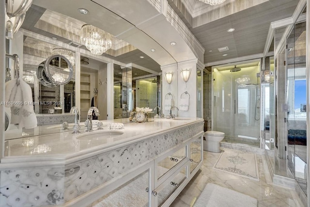 bathroom featuring an inviting chandelier, tile patterned flooring, walk in shower, toilet, and dual bowl vanity