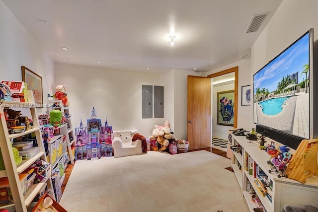 game room featuring light colored carpet and electric panel