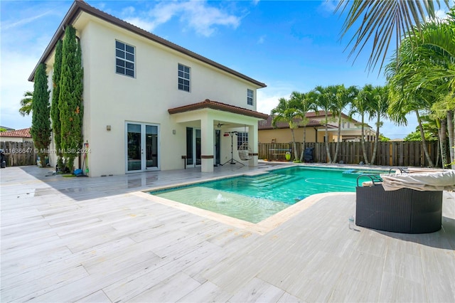 view of swimming pool with a patio and pool water feature