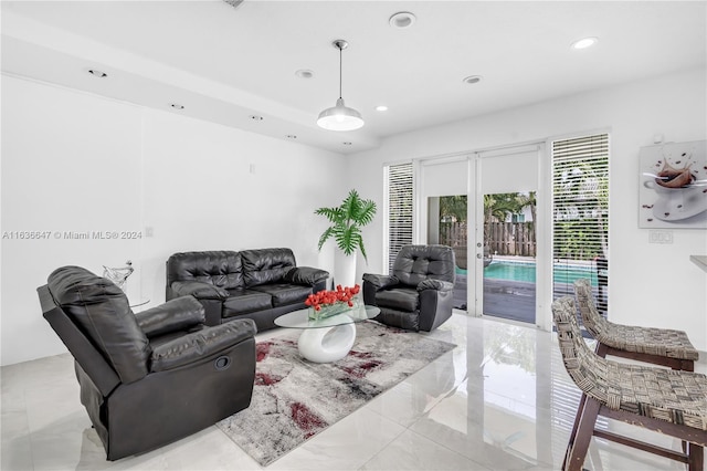 tiled living room featuring french doors