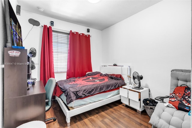 bedroom featuring hardwood / wood-style flooring