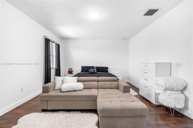 bedroom featuring dark hardwood / wood-style flooring