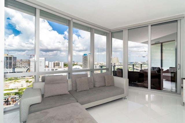 sunroom featuring a wealth of natural light and a view of city