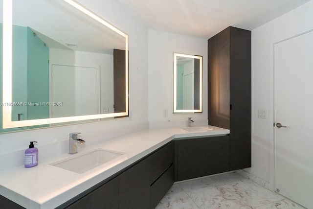 bathroom featuring marble finish floor, visible vents, and vanity