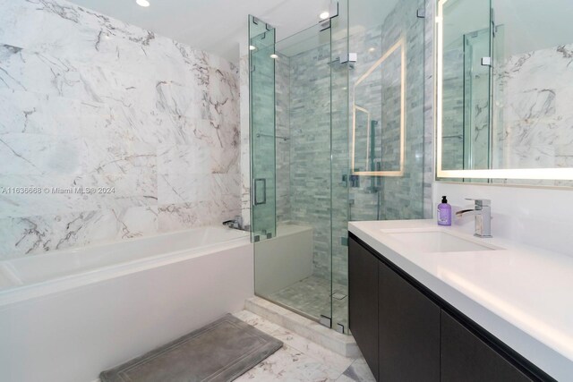 bathroom featuring vanity, separate shower and tub, and tile patterned flooring