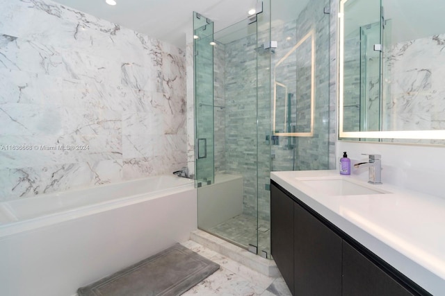 full bath featuring a shower stall, vanity, and a bath