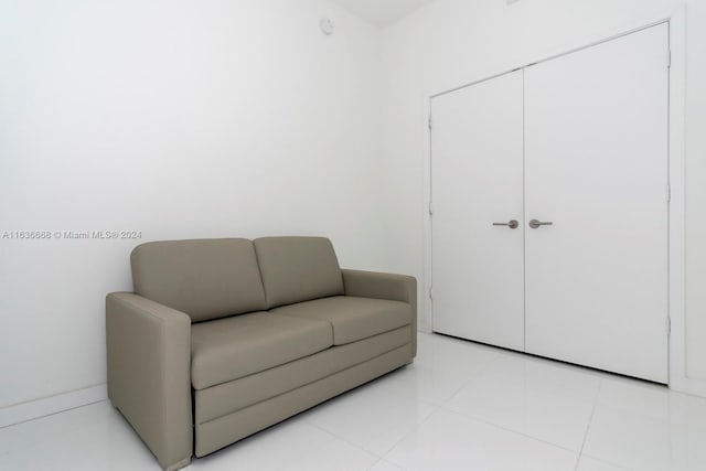 living area featuring light tile patterned flooring