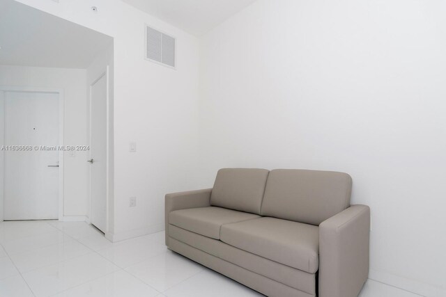 living area featuring light tile patterned floors